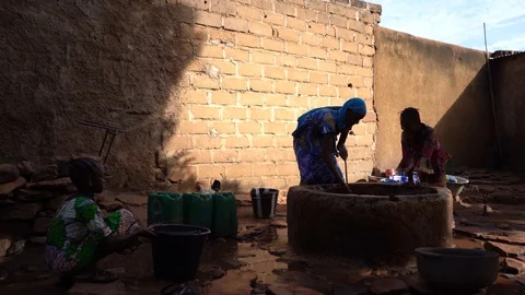 Black African Girls Filling Up Water Con... | Stock Video | Pond5