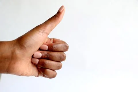 Black african hand gesturing thumbs up Stock Photos