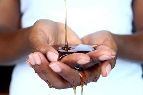 Black african indian cupped hands holding honey Stock Photos