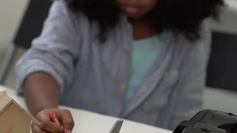 Black African kid creative class drawing at school Stock Footage 242938618