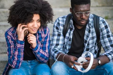 Black afro american young couple in outdoor leisure activity together Stock Photos