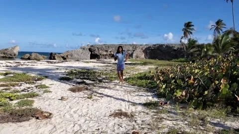 Black Afro Caribbean man exercise by running on beach, 4k Stock Footage 132420081