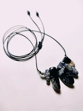 Black agate gemstone with blue inserts choker, jewelry Stock Photos
