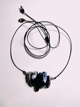 Black agate gemstone with blue inserts choker, jewelry Stock Photos