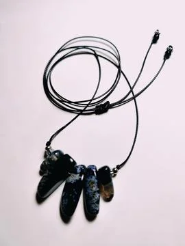 Black agate gemstone with blue inserts choker, jewelry Stock Photos