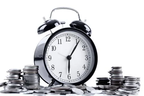 Black alarm clock and stack of coins for time of business and finance concept Stock Photos
