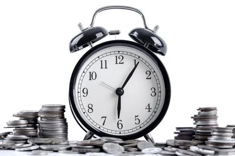 Black alarm clock and stack of coins for time of business and finance concept Stock Photos