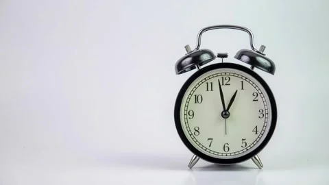 Black alarm clock on white background. Time concept. Antique alarms running.. Stock Footage 272759365