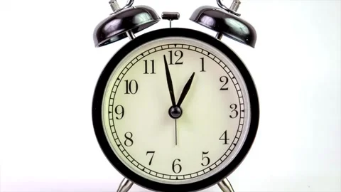 Black alarm clock on white background. Time concept. Antique alarms running time Stock Footage 336445118