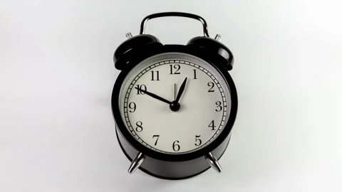 Black alarm clock on white background. Time concept. Antique alarms running time Stock-Footage 336445123