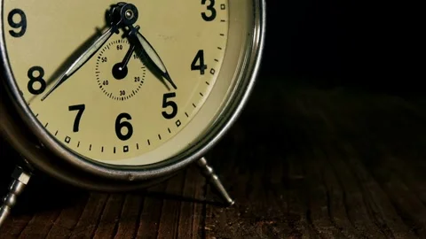Black alarm clock on white background. Time concept. Antique alarms running time Video stock 336445135