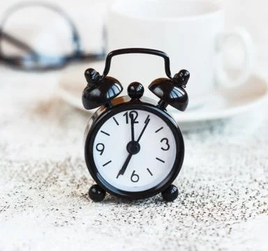 Black alarm clock on white background,concept morning Stock Photos