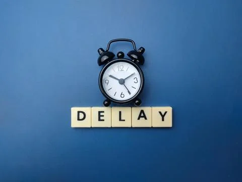 Black alarm clock with the word DELAY Stock Illustration