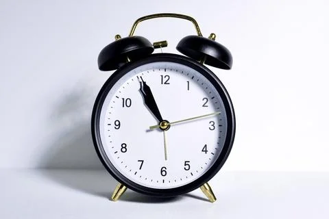 Black analog clock on white background Stock Photos