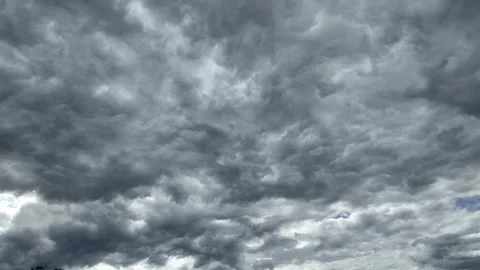 Black and gray clouds cover the sky. Clouds are approaching before a storm .. Stock Footage 340409938
