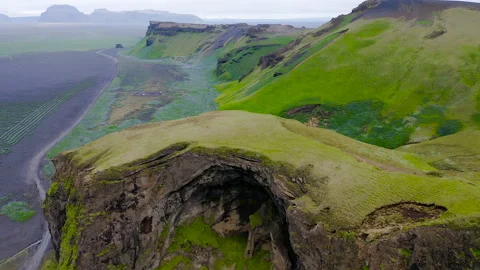 Black and Green cliffs around the mount Hjorleifshofdi. Stock Footage 249254966