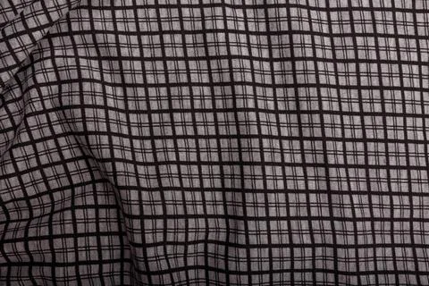 Black and grey checkboard pattern cotton fabric background, garment texture Stock Photos