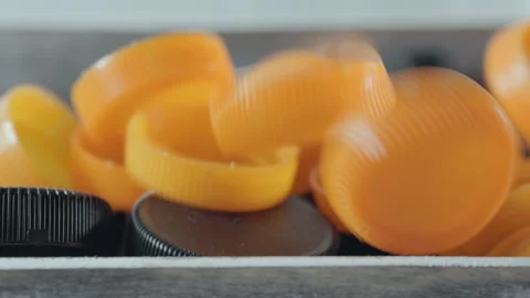 Black and orange  bottle plastic caps Stock Footage 252110407