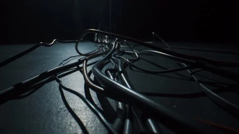Black and red cables lie on the floor, macro on Laowa 24mm f / 14 Macro.4k Stock Footage 125930956