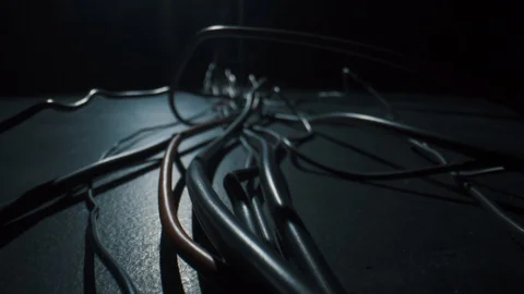 Black and red cables lie on the floor, macro on Laowa 24mm f 14 Macro.4k Stock Footage 126937801
