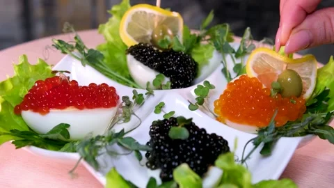 Black and red caviar, make lemon boats on toothpicks for decoration in a snack Stock Footage 270471007