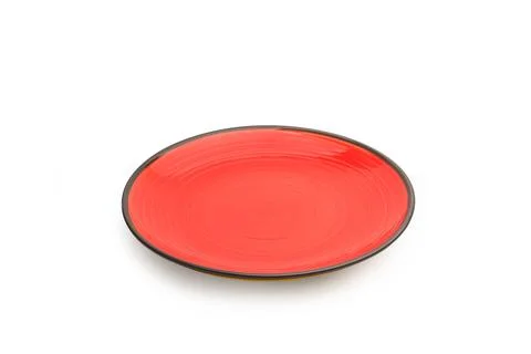 A black and red ceramic round dish on a white background with copy space Foto stock