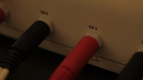 Black and Red Cords Plugged into Wall Stock Footage 109625215
