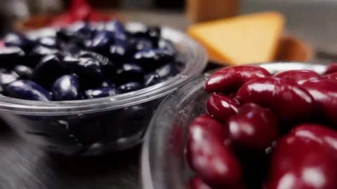 Black and red kidney beans in plates for chili recipe closeup Stock-Footage 311017343