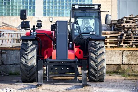 Black and red telehandler versatile agricultural and construction vehicle w.. Stock Photos