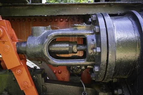 A black and red train engine with a red handle Photos