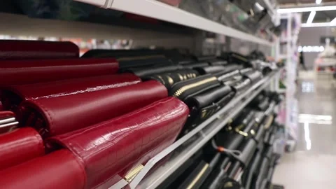 Black and red wallets on store shelves Stock Footage 254642459
