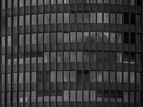 Black and white abstract texture of modern glass and metal building facade Foto stock