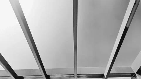 Black and White Abstract View Through Steel Pergola Beams Vídeos de archivo 334722188