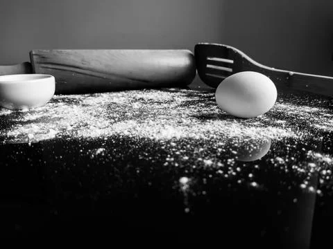 Black and White Baking Scene with Rolling Pin, Flour and Eggs Stock Photos