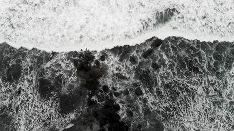 Black and white beach with wave over rock. Stock Footage 233557573