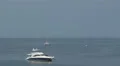 Black and white boat anchored in Panama Bay 4k or 4k+ Resolution