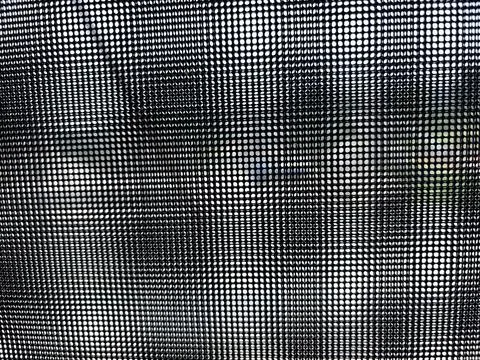 Black and white checkered pattern with a wavy effect. Stock Photos