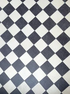 A black and white chess pattern of a floor Stock Photos
