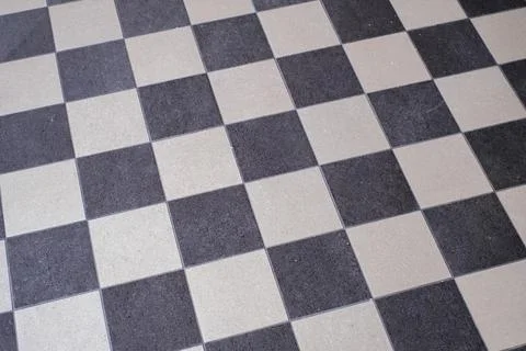 A black and white chess pattern of a floor Stock Photos