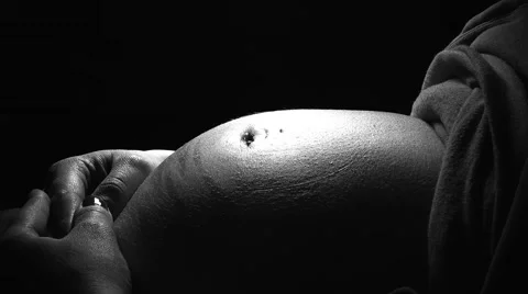 Black and White Close up Video of Pregnant Mother's Belly Stock Footage 49079436