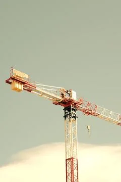 Black and white construction crane with blue sky. Stock Photos