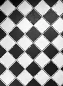 Black and white diamond pattern floor tiles with grout lines Stock Photos