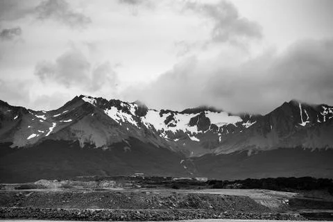 Black and white dramatic landscape of Patagonian mountains, taken from the be Stock Photos
