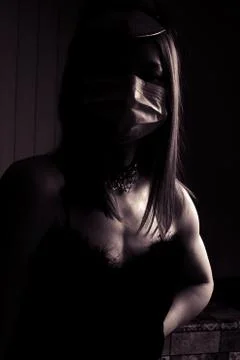 Black and white dramatic portrait of young woman in a medical mask Stock Photos