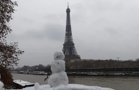 The black and white Eiffel tower with snowman in the foreground, Paris, Franc Stock Photos