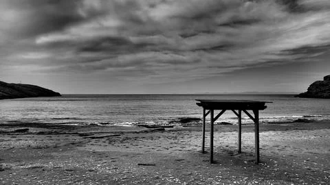 Black And White Empty Beach With Dramatic Sky On Kea Island Greece Фото