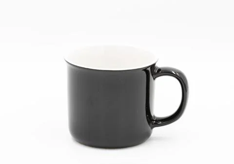 Black and white empty coffee mug standing on white background Фото
