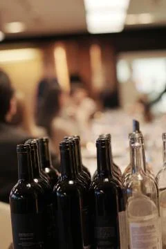 Black and white empty wine bottles on a table at the wine tasting event Stock Photos
