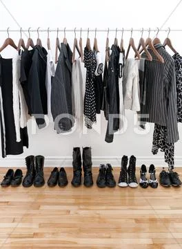 Black and white female clothes and shoes Stock Photos
