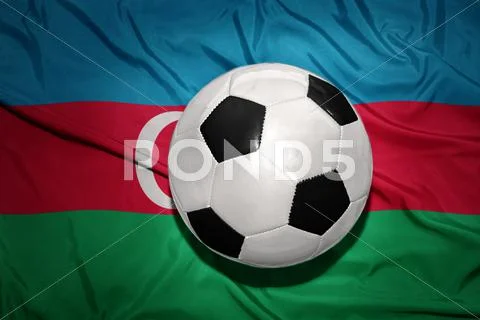 Black and white football ball on the national flag of azerbaijan Stock Photos